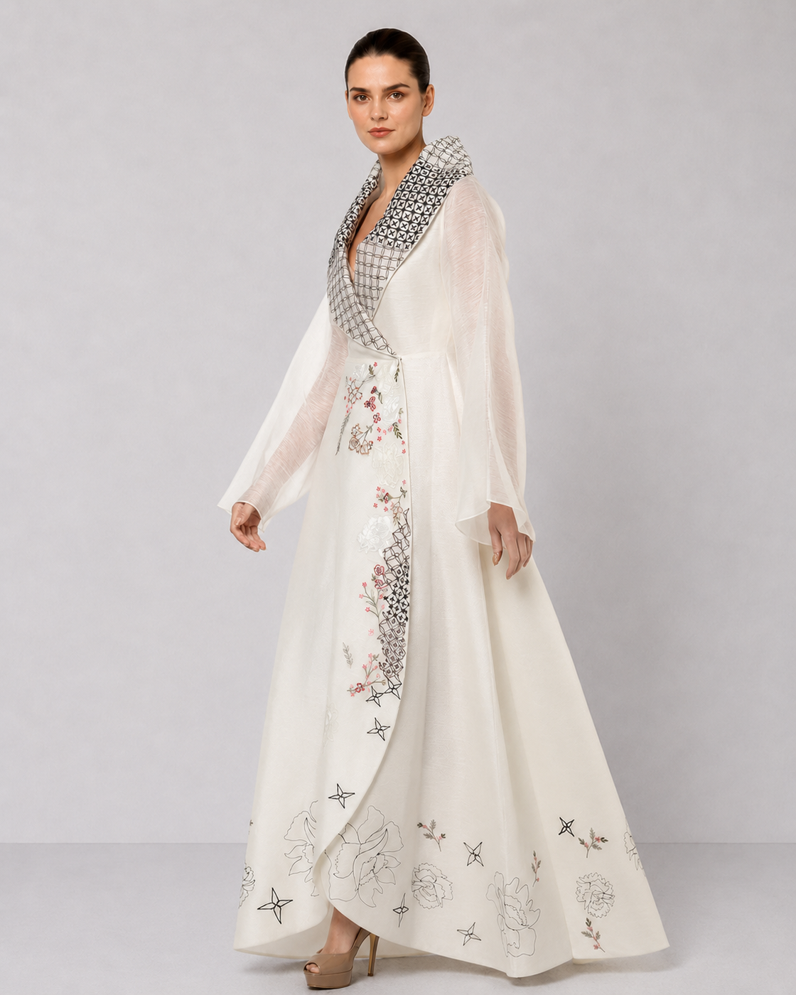 Ivory wrap gown with statement embroidered collar and sheer bell sleeves.