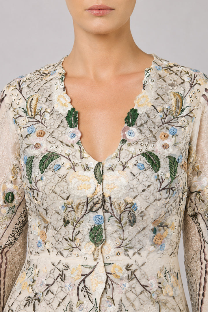 Ivory Embroidered Gown With Pastel Floral Motifs And Elegant V-Neckline.