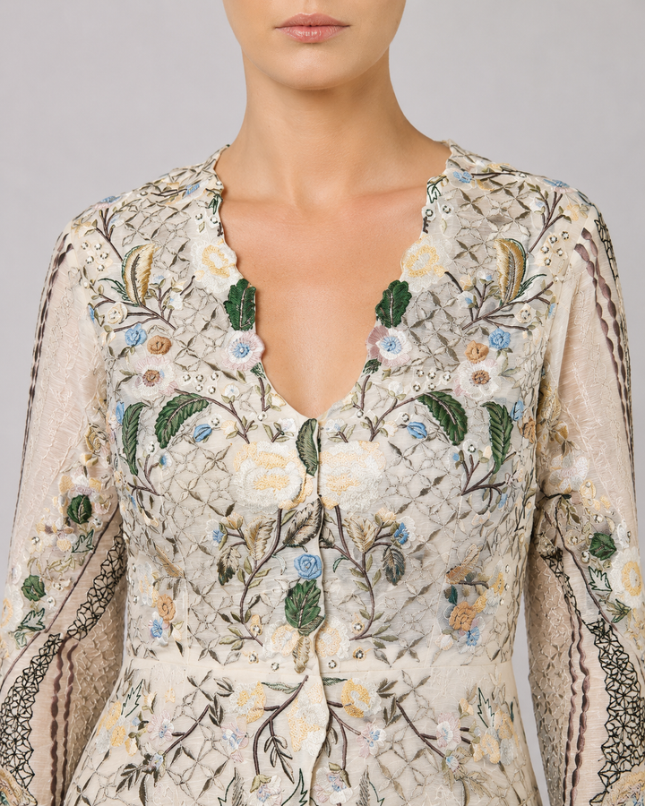 Ivory Embroidered Gown With Pastel Floral Motifs And Elegant V-Neckline.