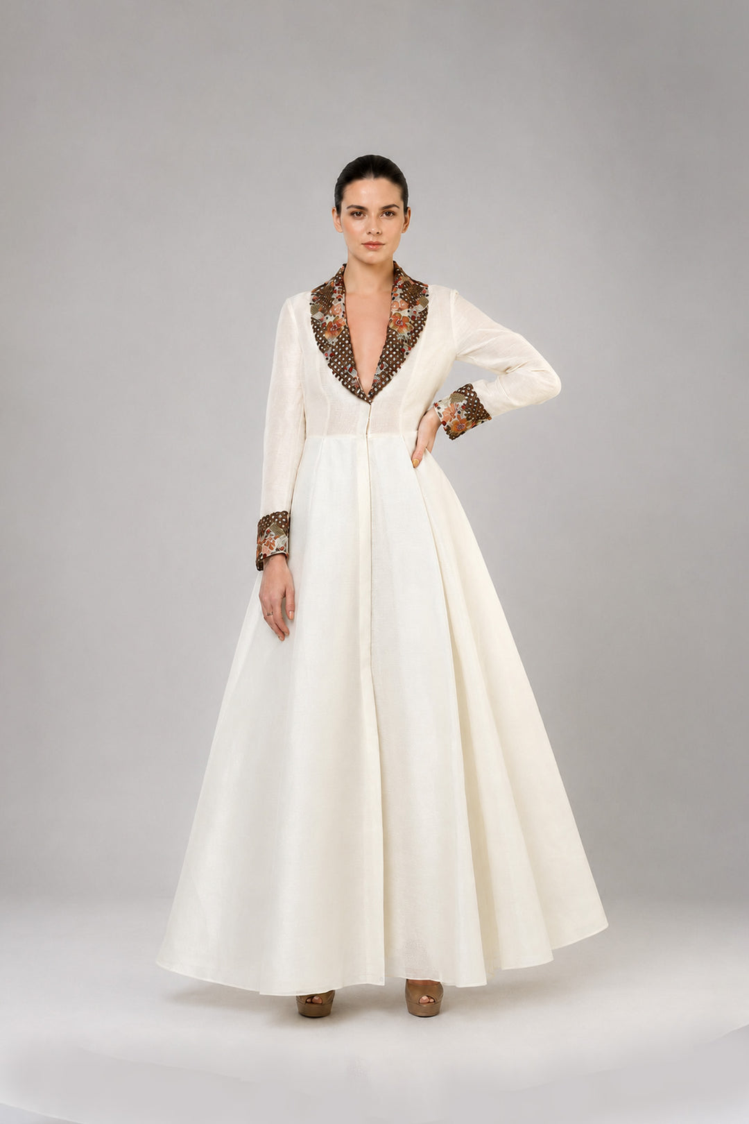 Ivory A-Line Gown With Embroidered Lapel Collar And Statement Cuffs.