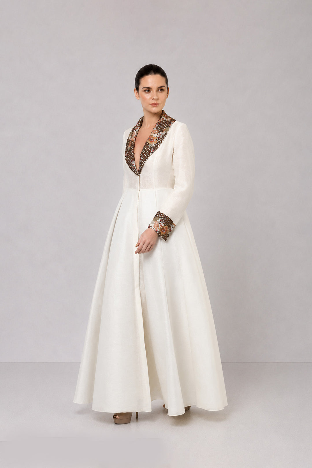 Ivory A-Line Gown With Embroidered Lapel Collar And Statement Cuffs.