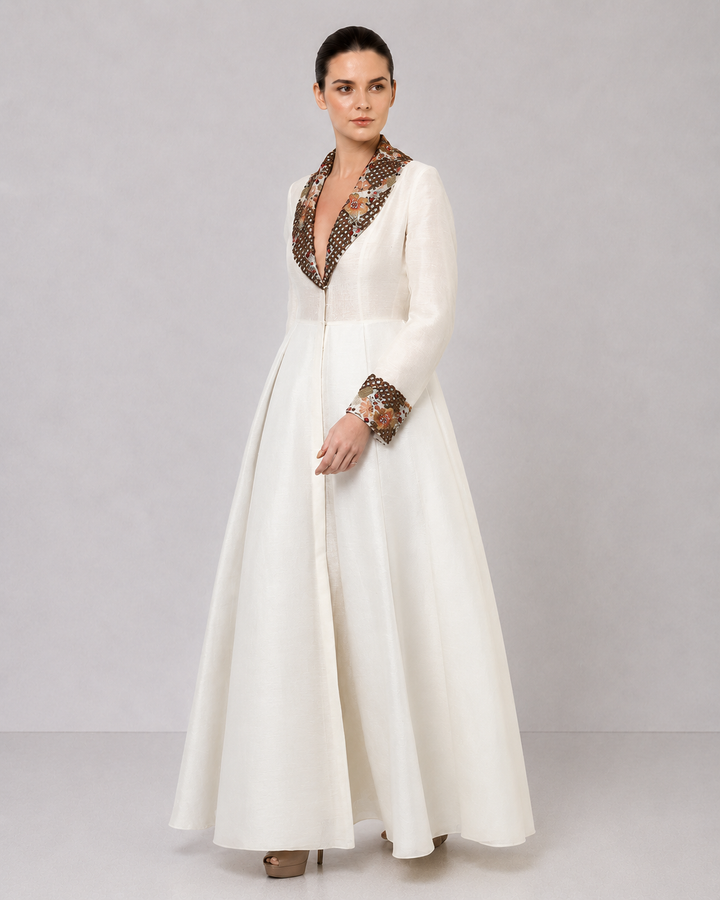 Ivory A-Line Gown With Embroidered Lapel Collar And Statement Cuffs.