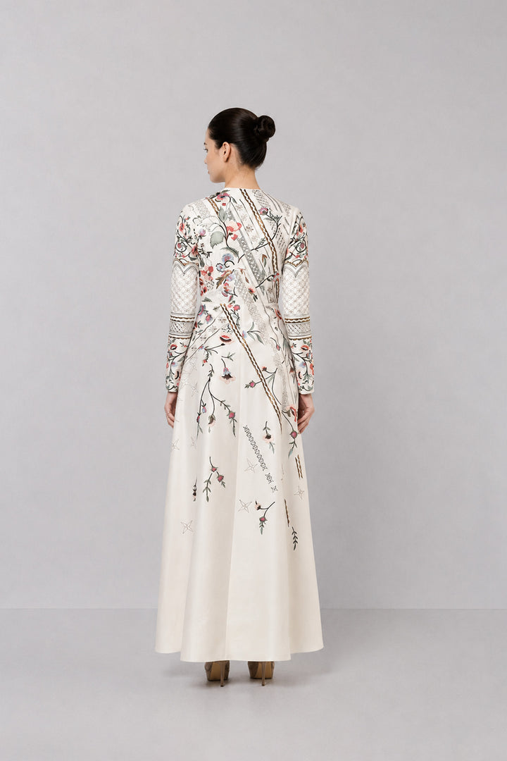 Ivory Embroidered Gown With Architectural Paneling And Intricate Floral Motifs.