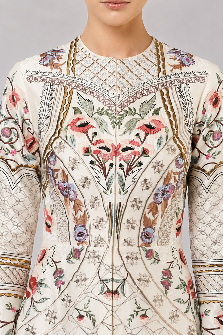 Ivory Embroidered Gown With Architectural Paneling And Intricate Floral Motifs.