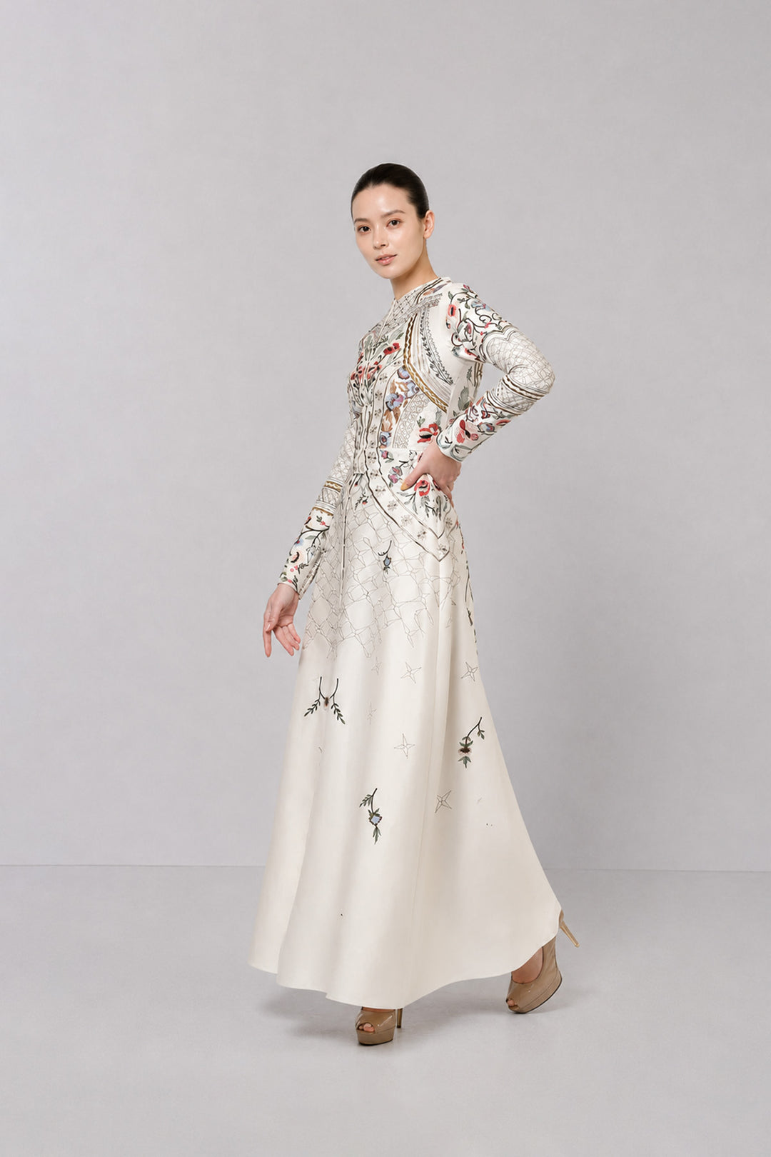 Ivory Embroidered Gown With Architectural Paneling And Intricate Floral Motifs.