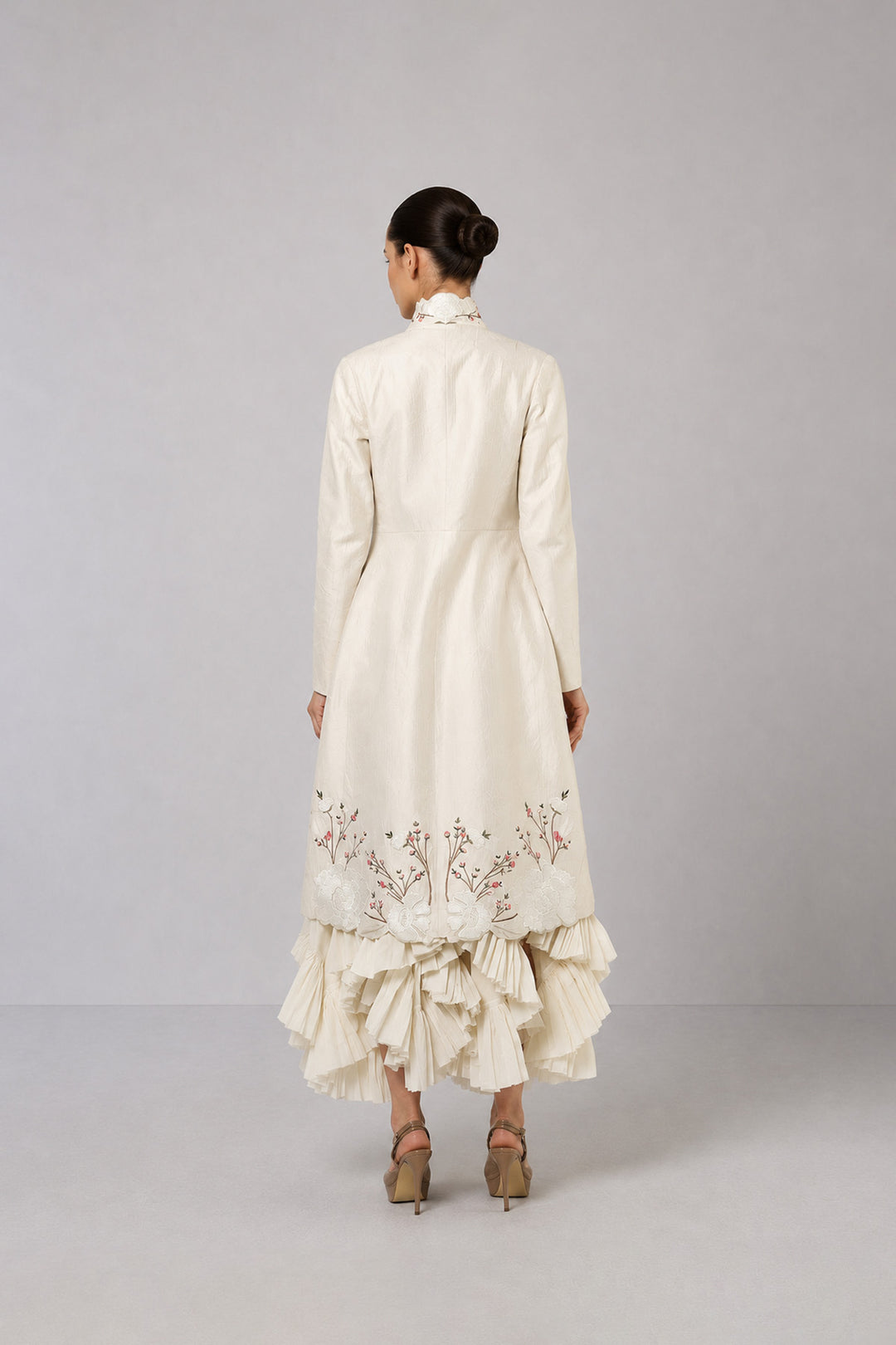 Ivory Layered Dress With Embroidered Jacket And Cascading Pleated Hem.