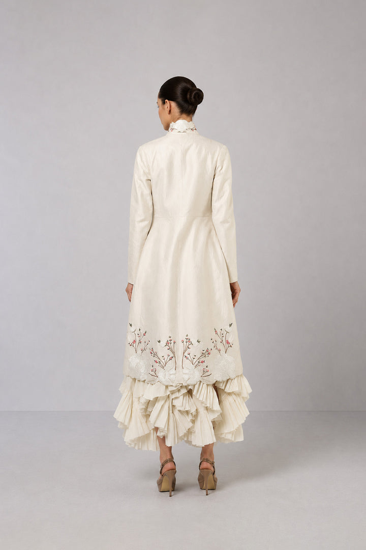 Ivory Layered Dress With Embroidered Jacket And Cascading Pleated Hem.