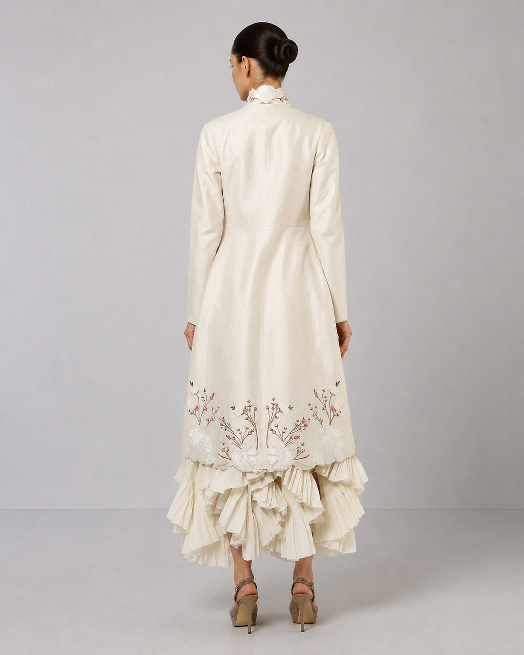 Ivory Layered Dress With Embroidered Jacket And Cascading Pleated Hem.
