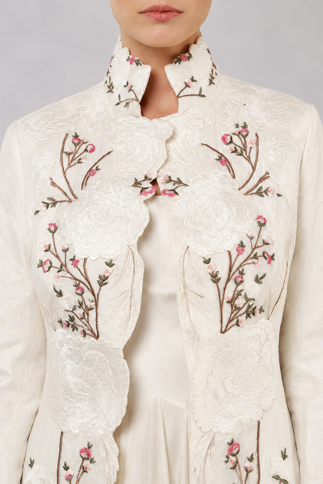 Ivory Layered Dress With Embroidered Jacket And Cascading Pleated Hem.