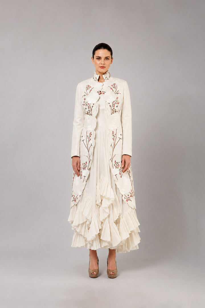 Ivory Layered Dress With Embroidered Jacket And Cascading Pleated Hem.