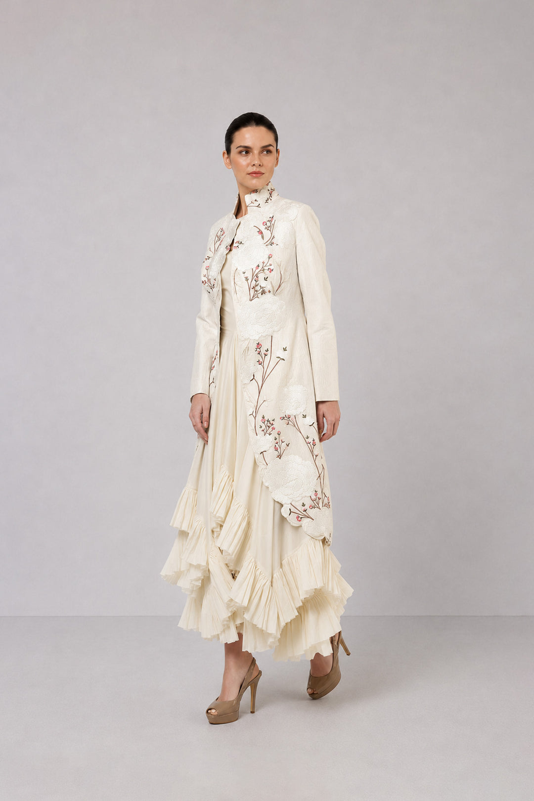 Ivory Layered Dress With Embroidered Jacket And Cascading Pleated Hem.