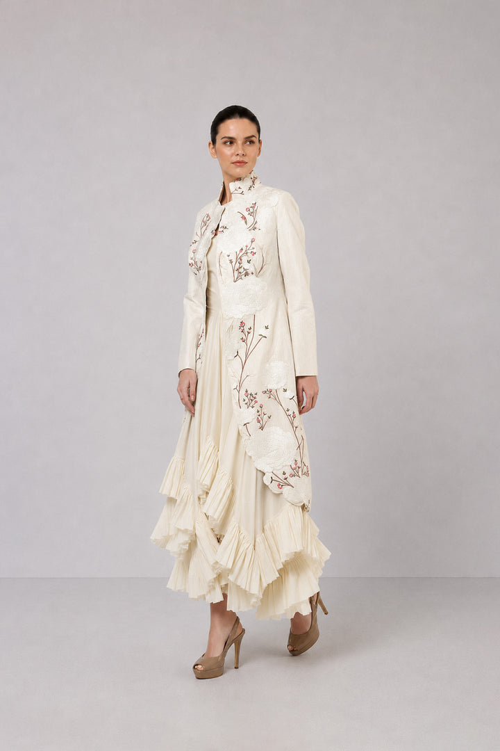 Ivory Layered Dress With Embroidered Jacket And Cascading Pleated Hem.
