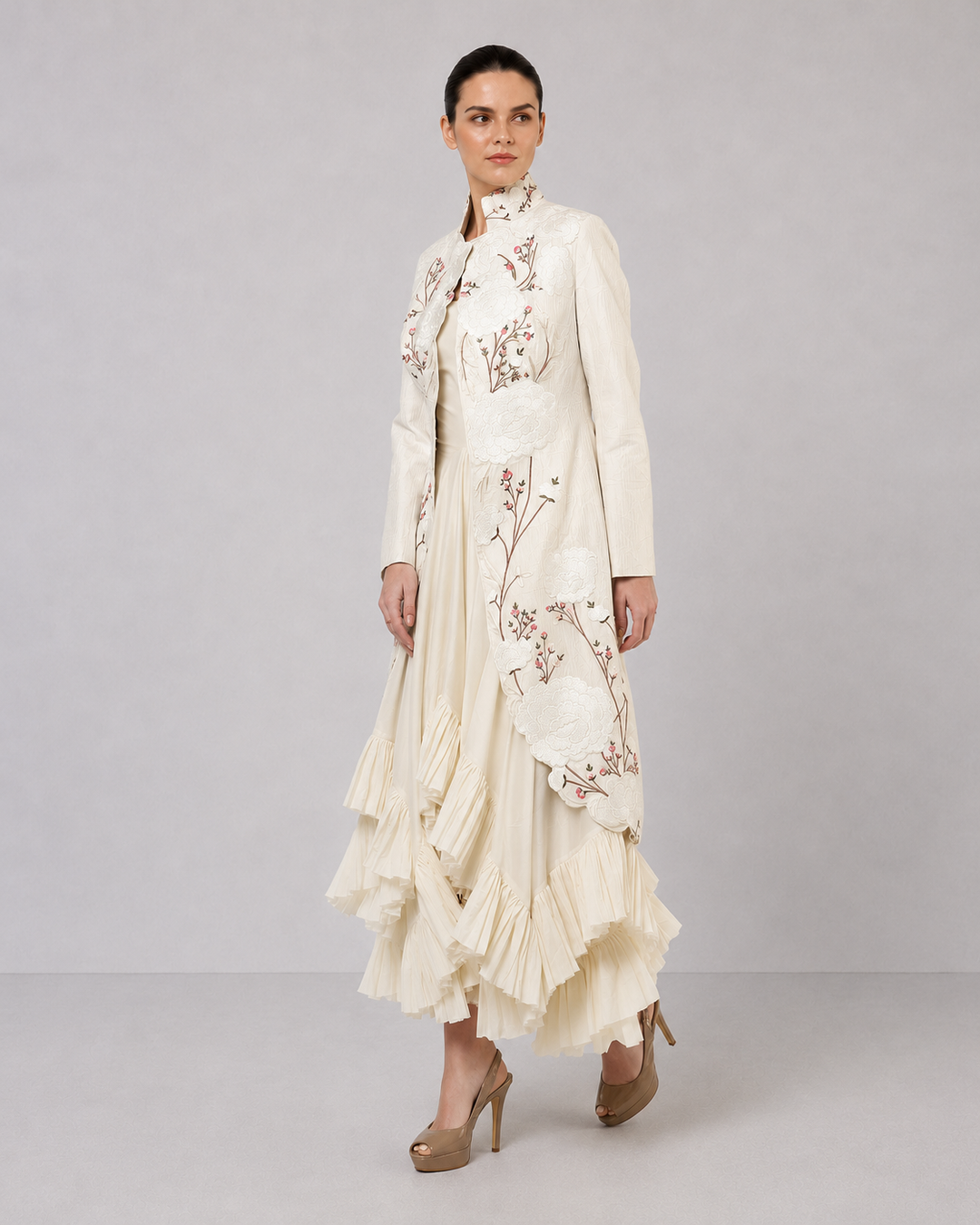 Ivory Layered Dress With Embroidered Jacket And Cascading Pleated Hem.