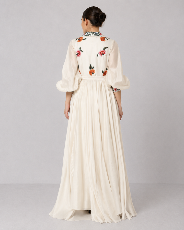 Ivory Embroidered Gown With Floral Lapel Collar Featuring Gathers And Bishop Sleeves.