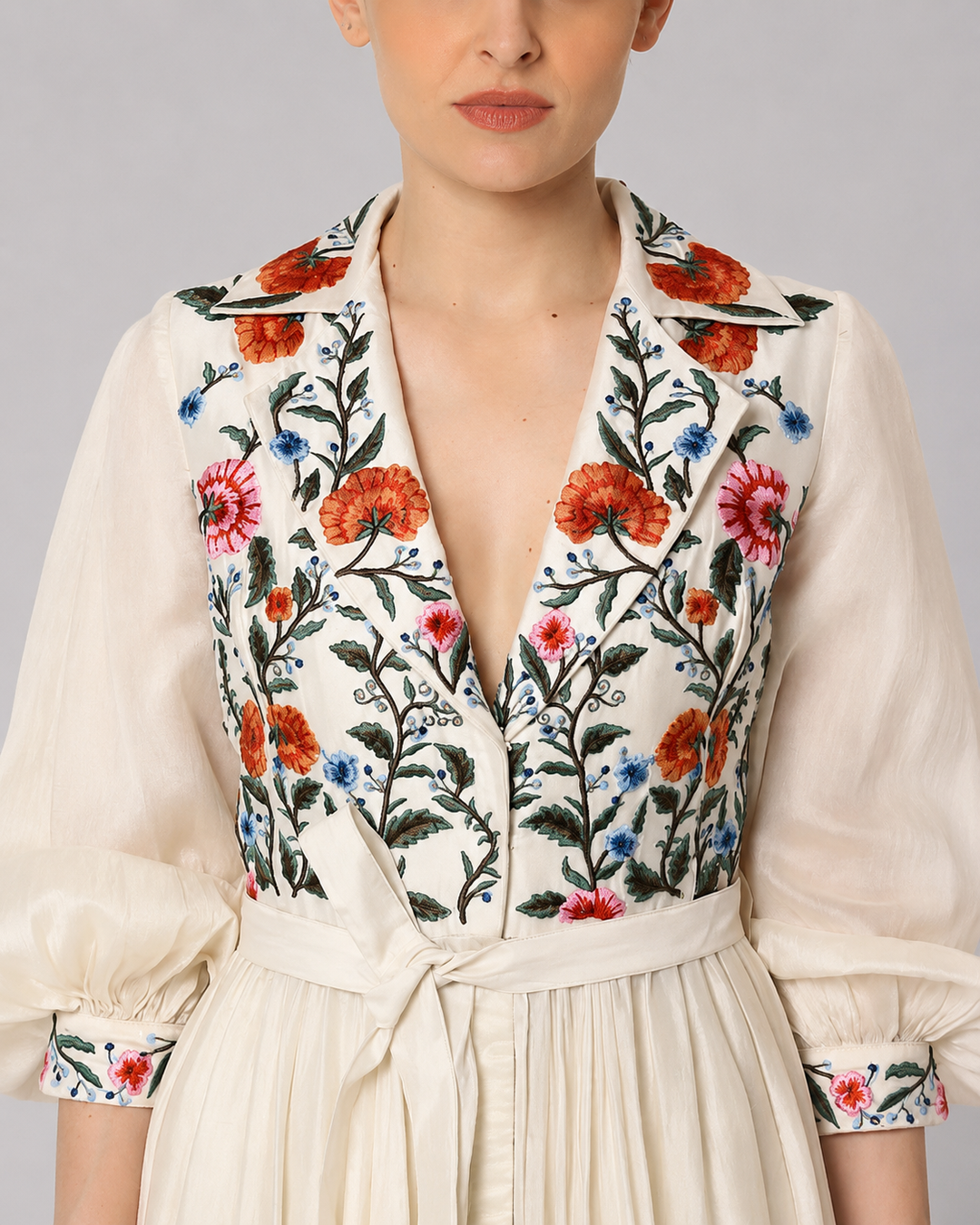 Ivory Embroidered Gown With Floral Lapel Collar Featuring Gathers And Bishop Sleeves.