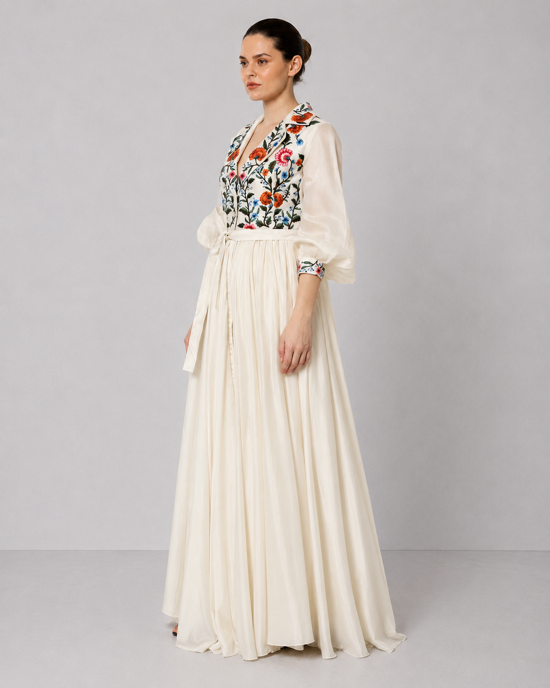 Ivory Embroidered Gown With Floral Lapel Collar Featuring Gathers And Bishop Sleeves.