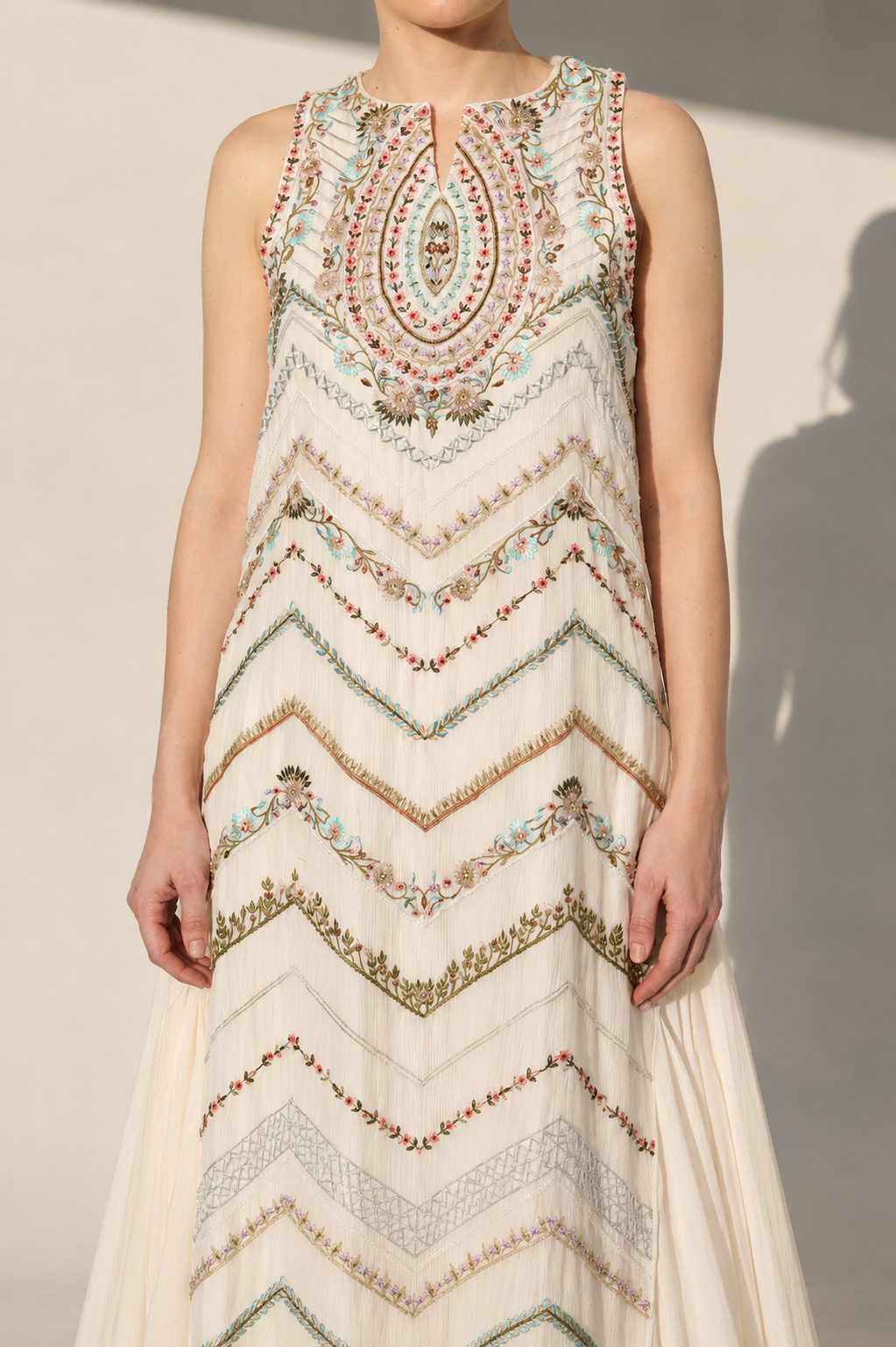 Ivory Embellished Gown With Geometric Embroidery And Flowing Cape Drape.