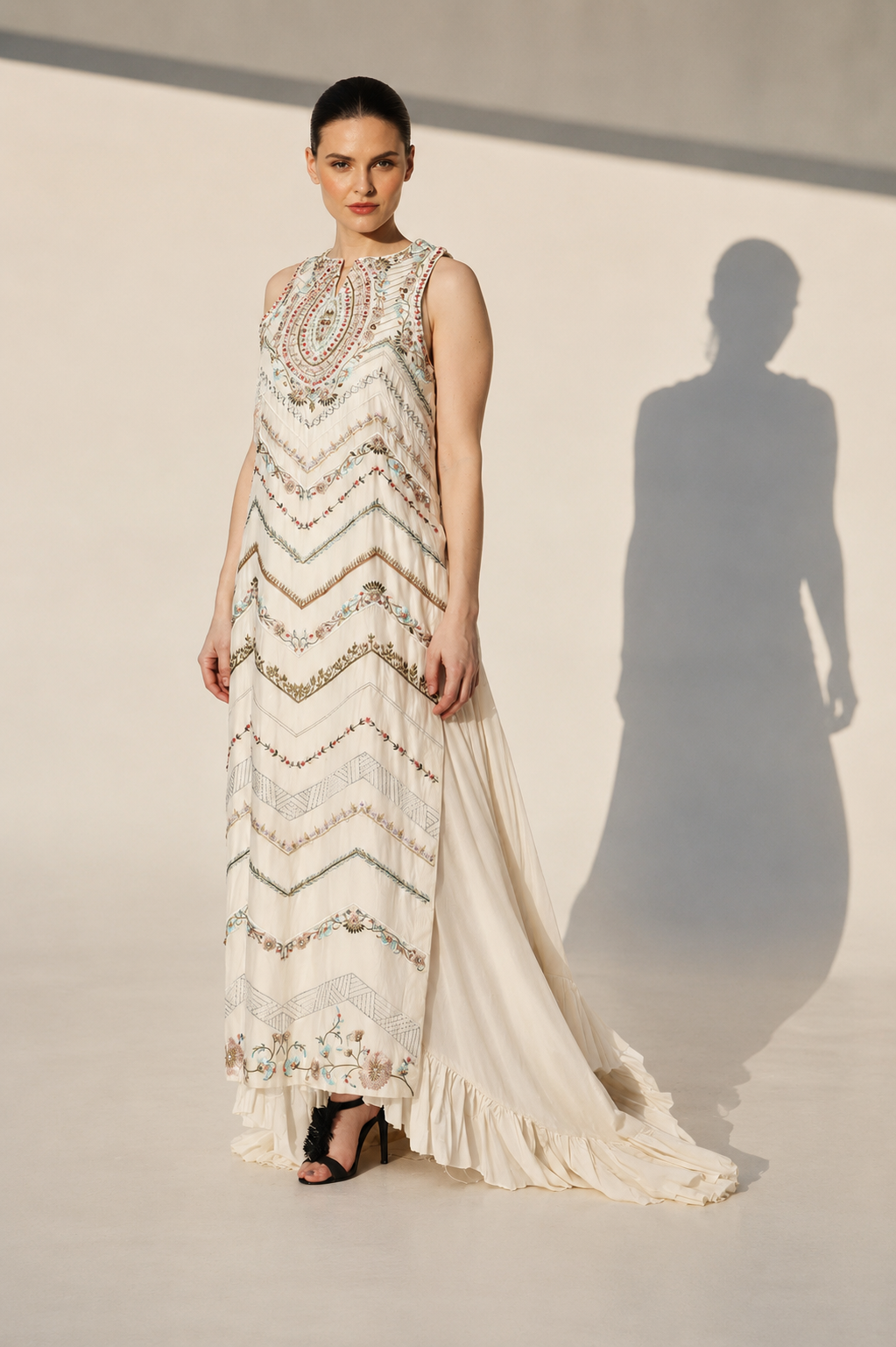 Ivory Embellished Gown With Geometric Embroidery And Flowing Cape Drape.