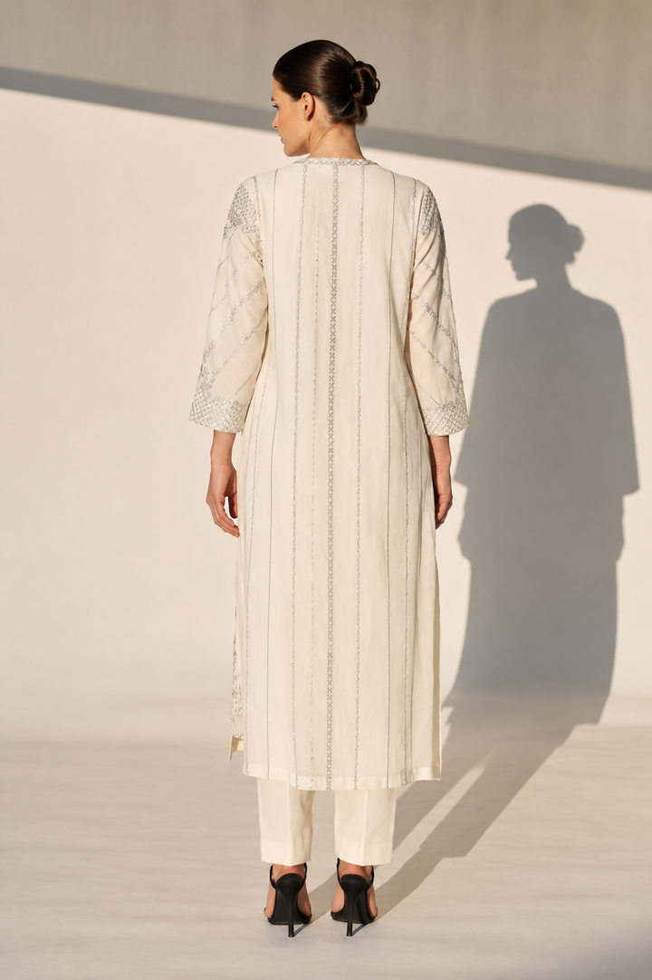 Mustard Embroidered Kurta With Intricate Silver Threadwork And A Graceful A-Line Silhouette Paired With Pants.