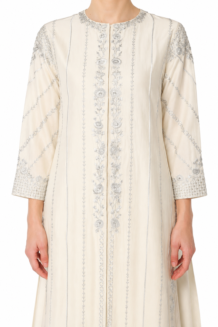 Mustard Embroidered Kurta With Intricate Silver Threadwork And A Graceful A-Line Silhouette Paired With Pants.