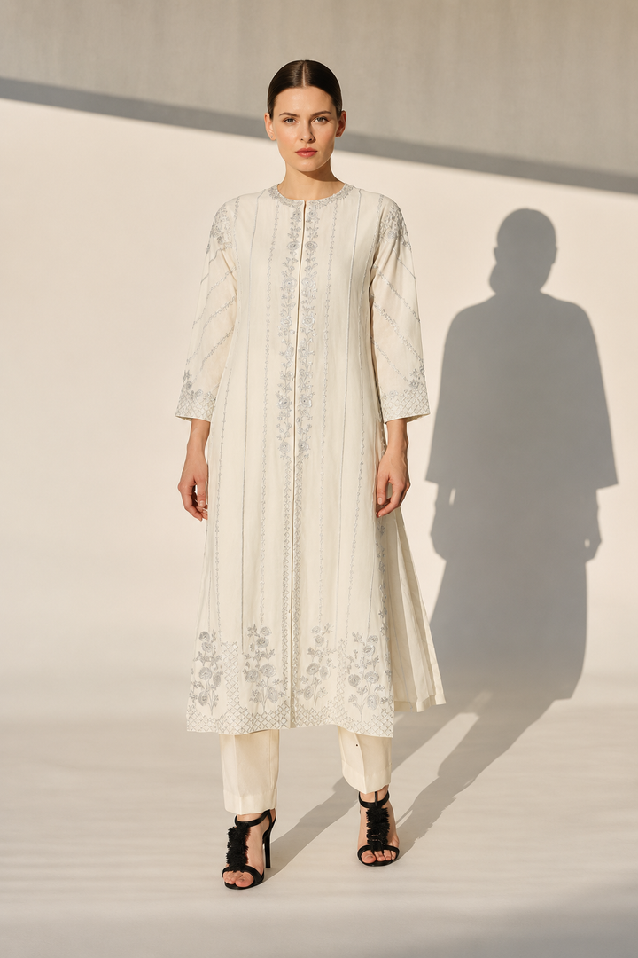 Mustard Embroidered Kurta With Intricate Silver Threadwork And A Graceful A-Line Silhouette Paired With Pants.