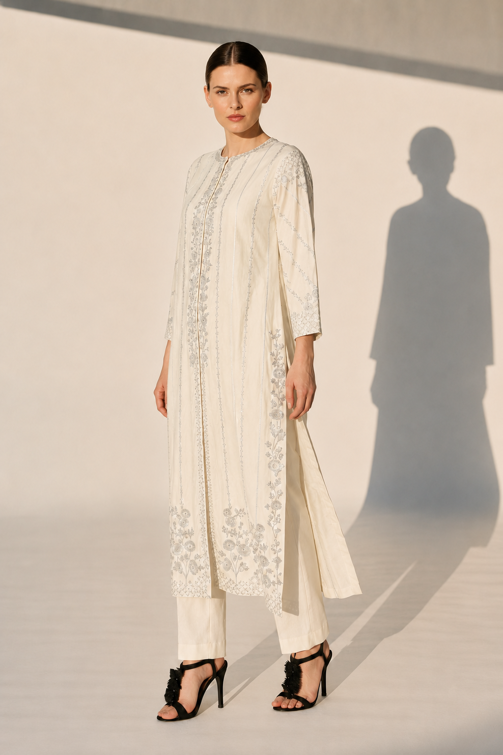 Mustard Embroidered Kurta With Intricate Silver Threadwork And A Graceful A-Line Silhouette Paired With Pants.