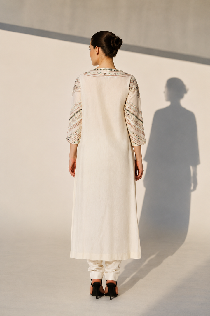 Ivory Embroidered Kurta Set With Floral Panel Detailing And Contrast-Edged Dupatta.