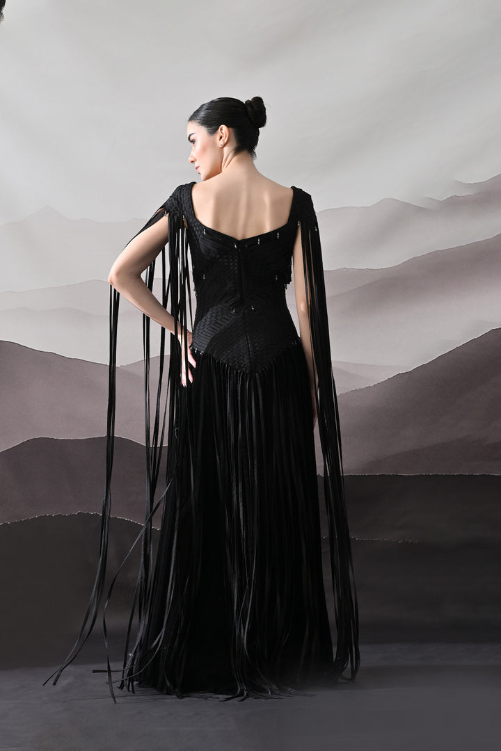 Black Gown With Silhouette Defined By Texture And Movement