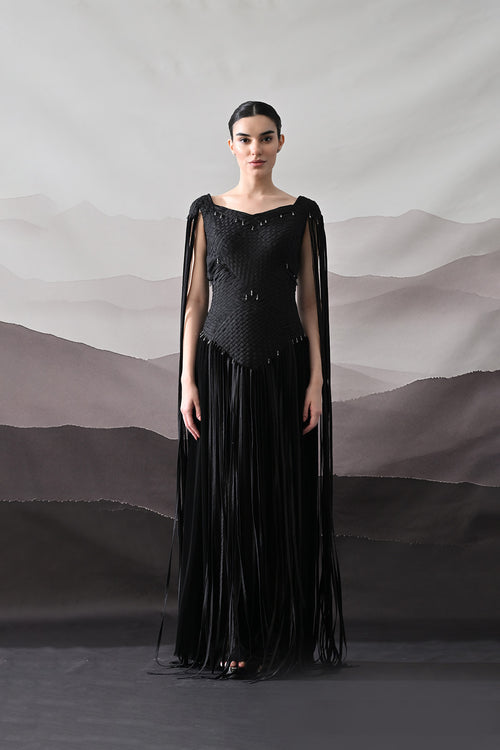 Black Gown With Silhouette Defined By Texture And Movement