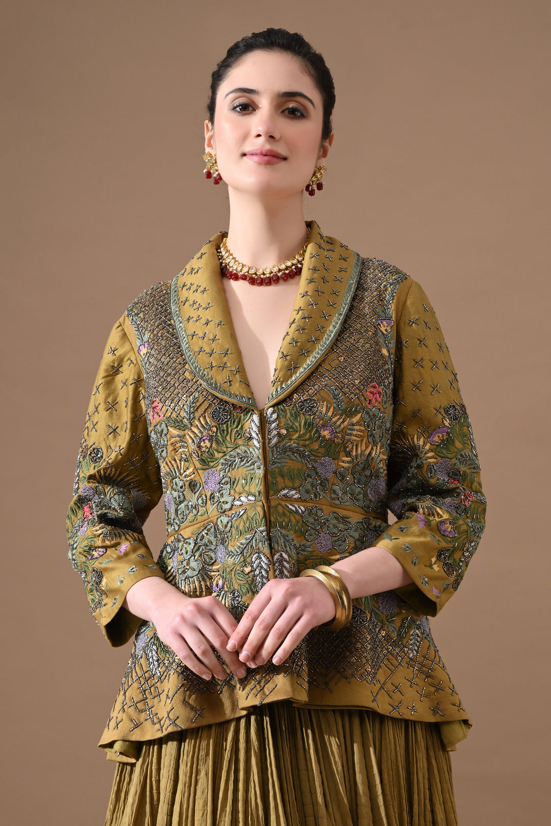 A Olive Green Jacket Features Intricate All-Over Embroidery With Skirt