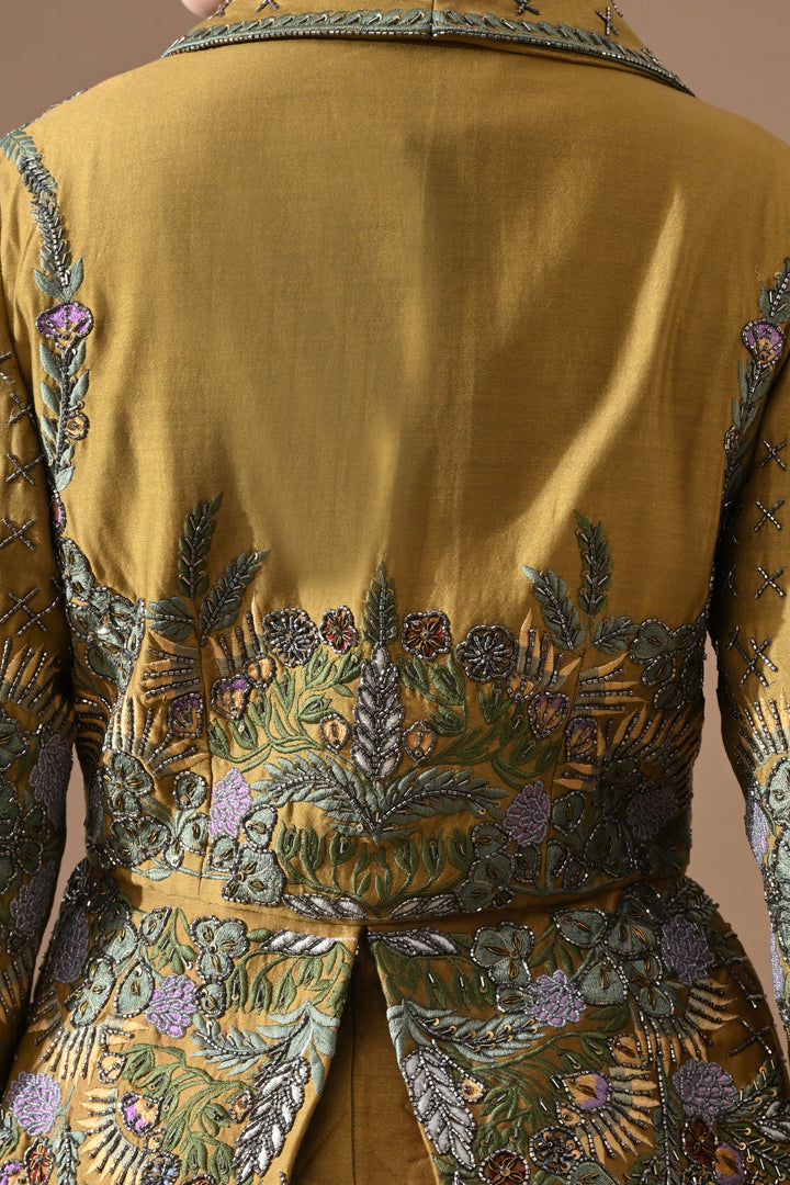 A Olive Green Jacket Features Intricate All-Over Embroidery With Skirt