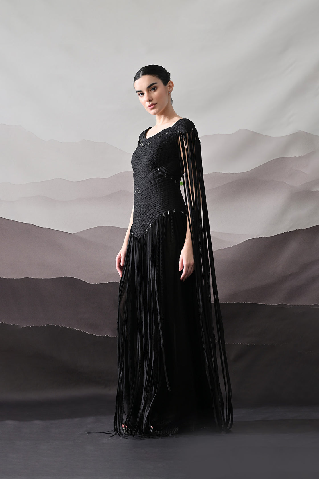 Black Gown With Silhouette Defined By Texture And Movement