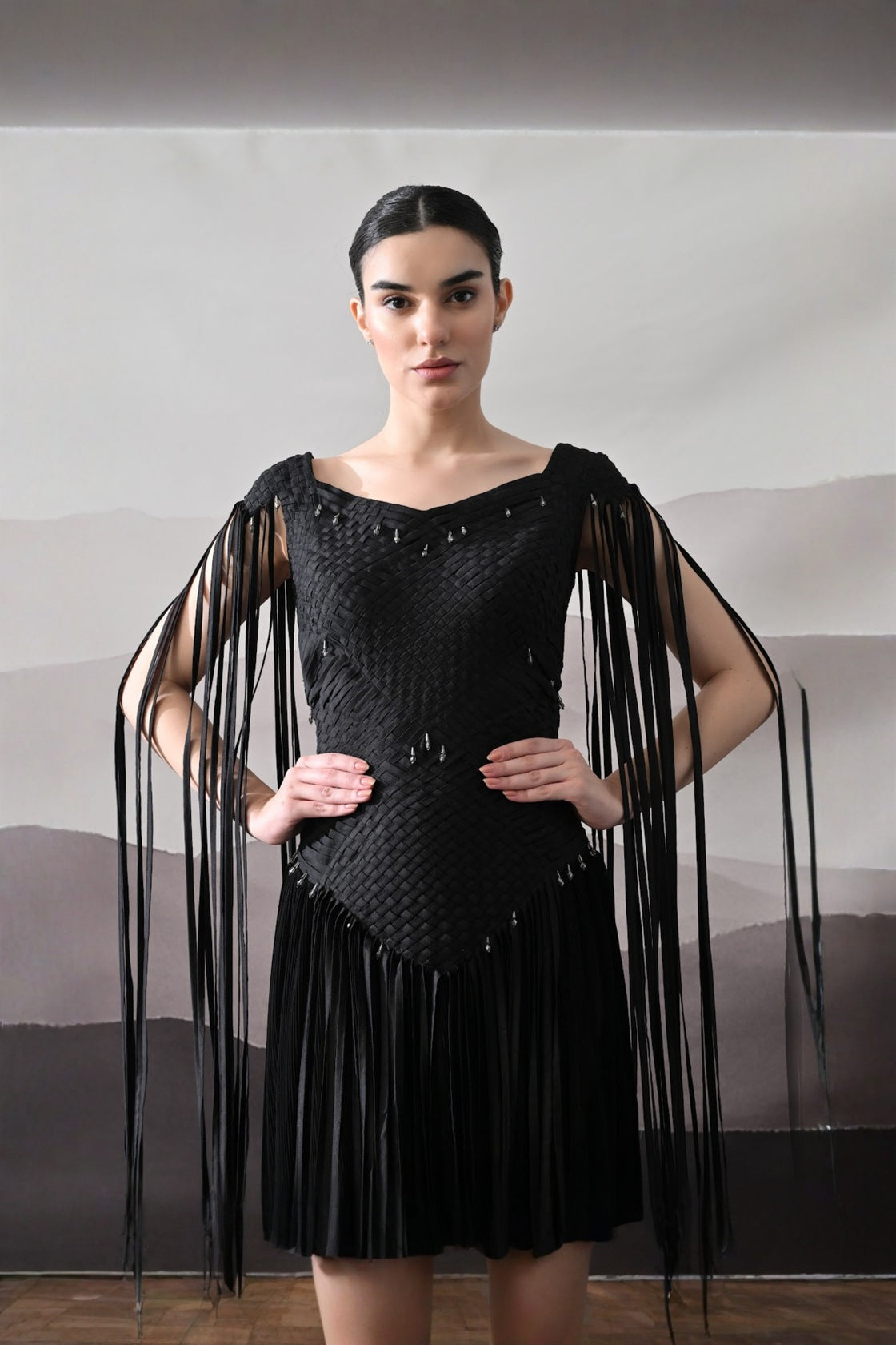 Black Gown With Silhouette Defined By Texture And Movement