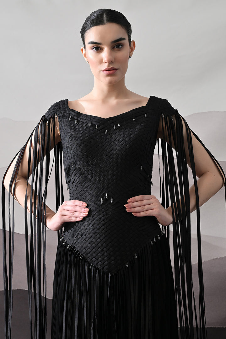 Black Gown With Silhouette Defined By Texture And Movement