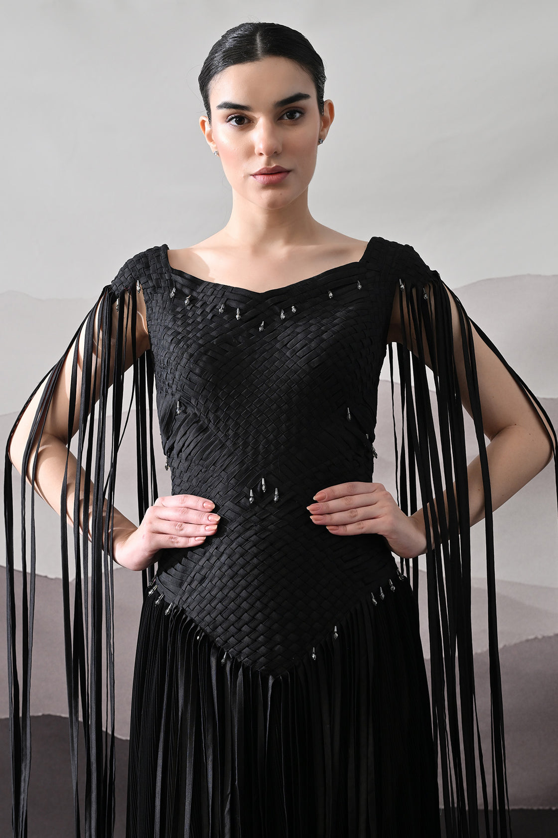 Black Gown With Silhouette Defined By Texture And Movement