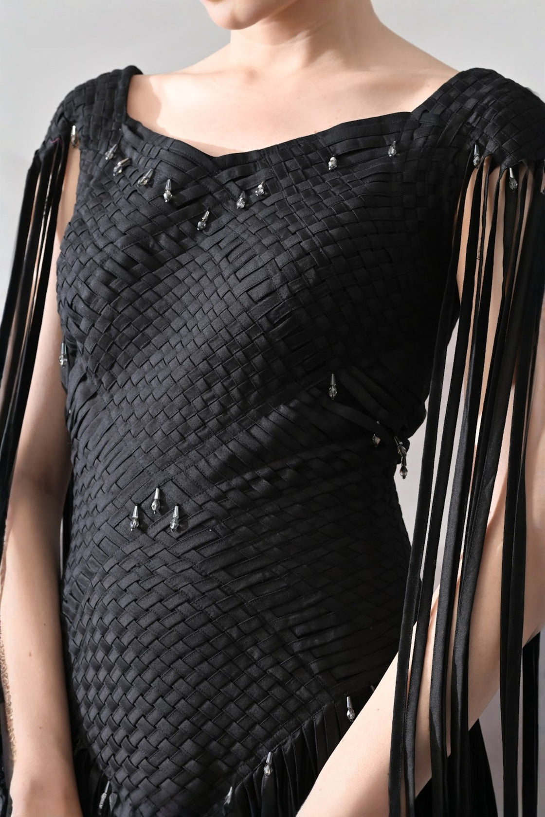 Black Gown With Silhouette Defined By Texture And Movement