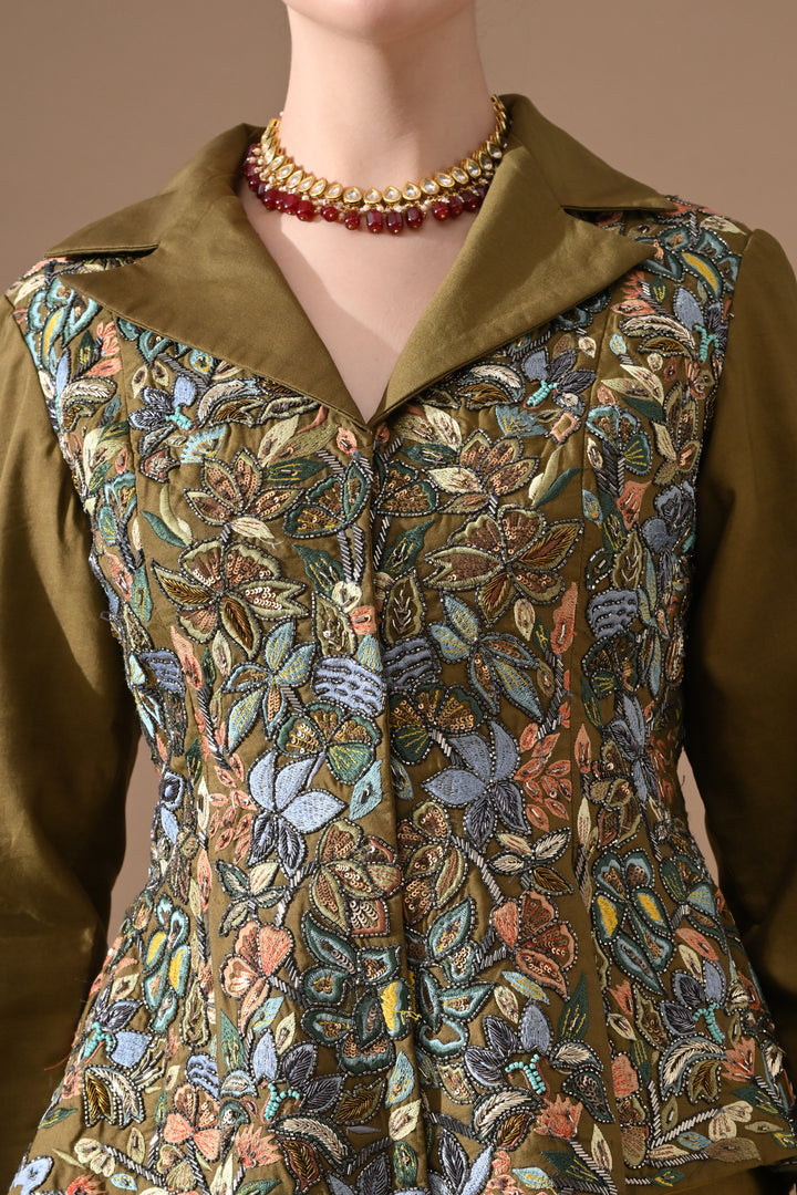 A Olive Green Jacket Features Intricate All-Over Embroidery With Skirt