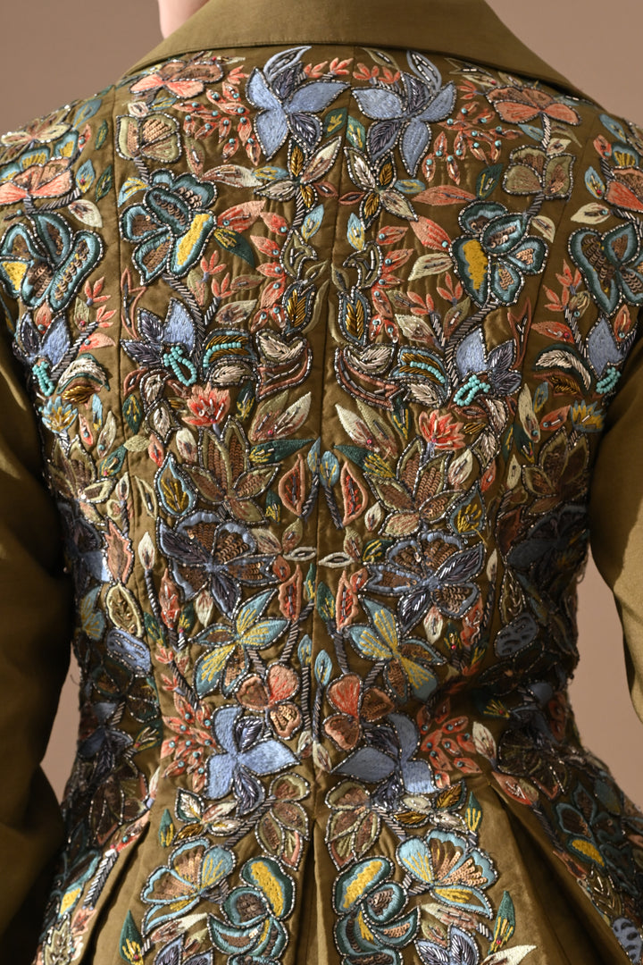 A Olive Green Jacket Features Intricate All-Over Embroidery With Skirt