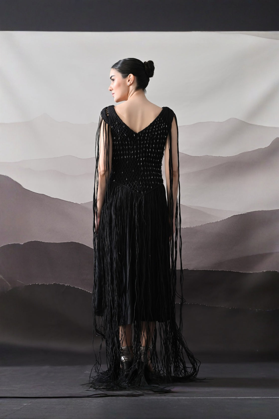 Black Gown With Artisanal Weave And Fringe Detailing