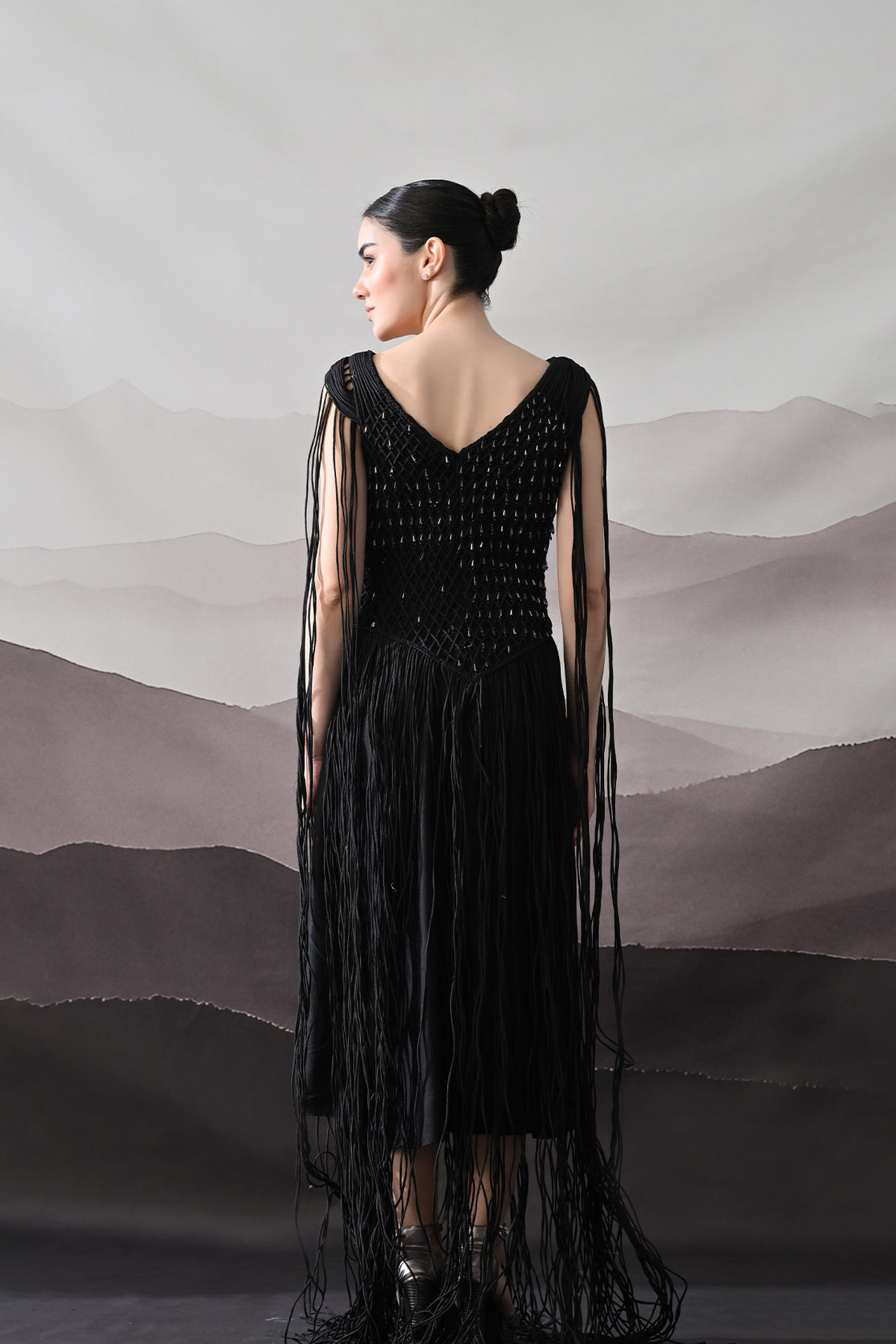 Black Gown With Artisanal Weave And Fringe Detailing