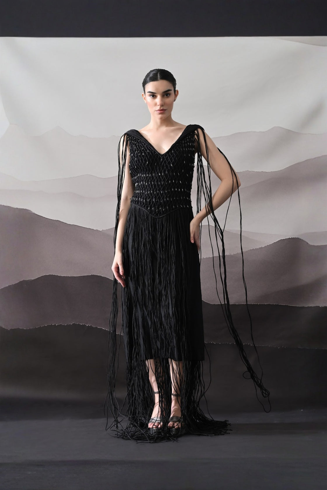 Black Gown With Artisanal Weave And Fringe Detailing