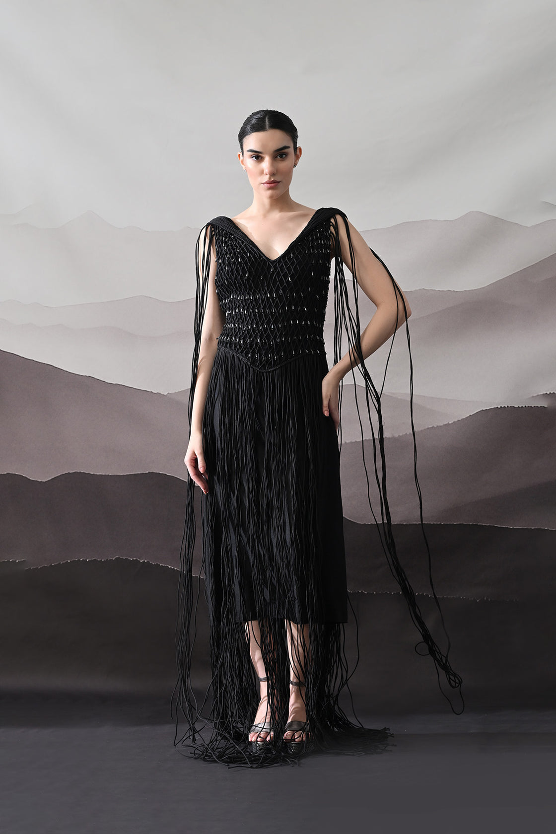 Black Gown With Artisanal Weave And Fringe Detailing