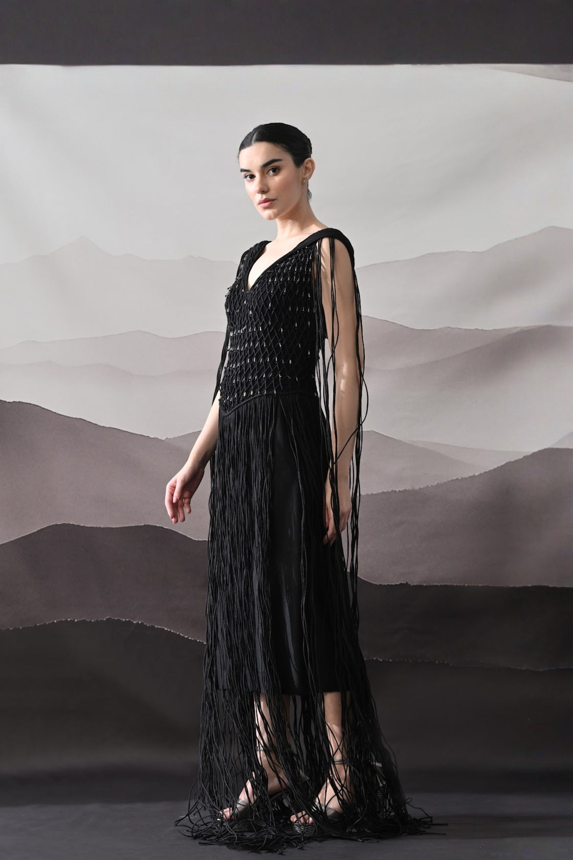 Black Gown With Artisanal Weave And Fringe Detailing