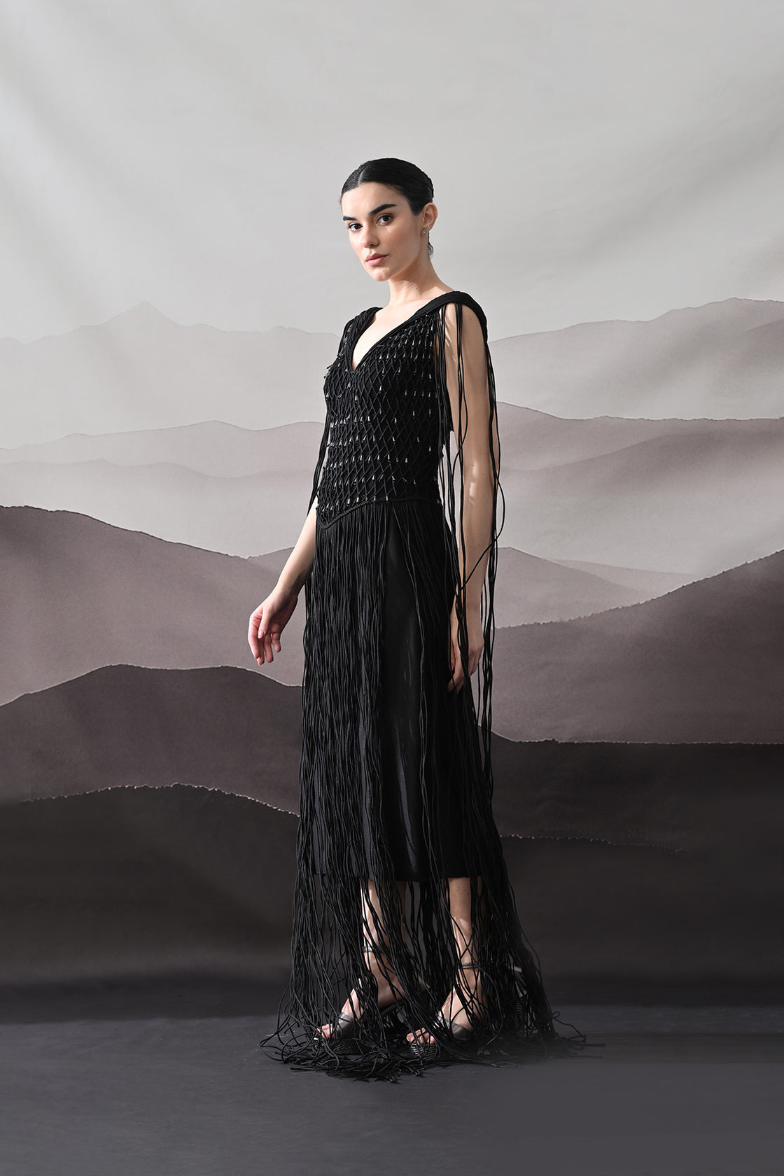 Black Gown With Artisanal Weave And Fringe Detailing