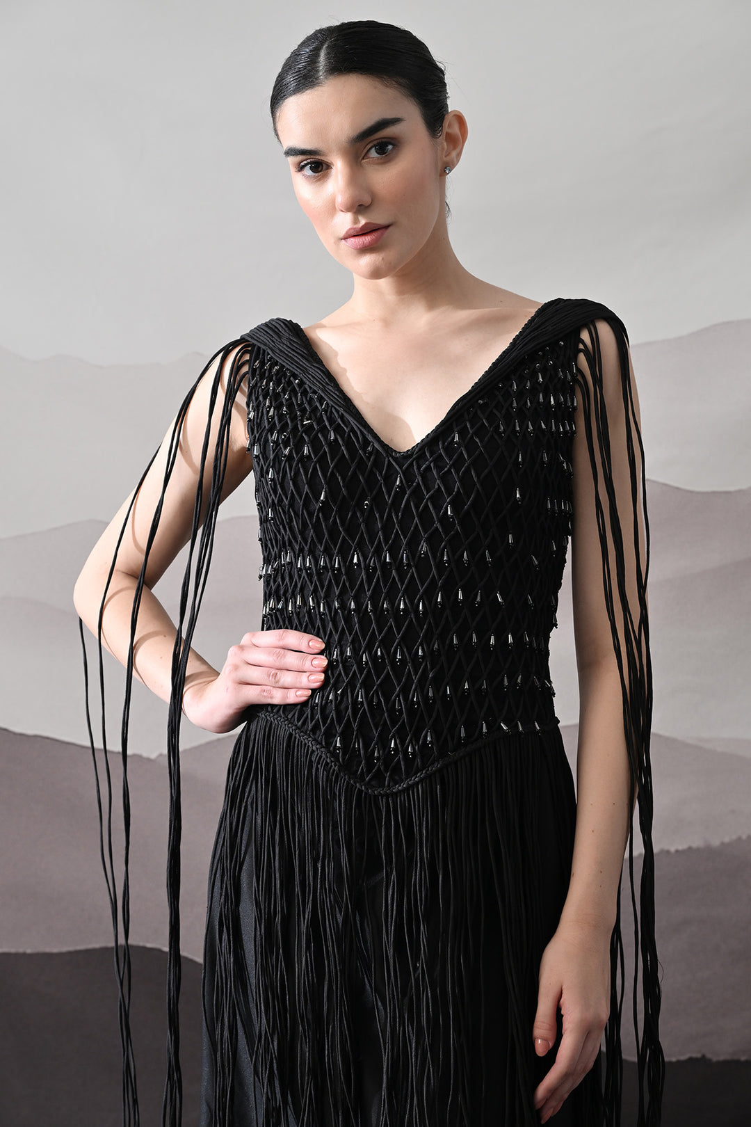 Black Gown With Artisanal Weave And Fringe Detailing