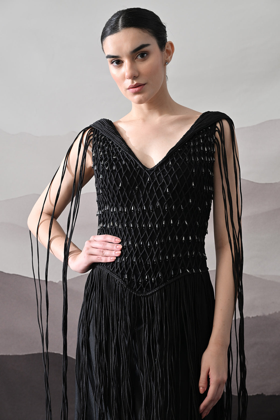 Black Gown With Artisanal Weave And Fringe Detailing