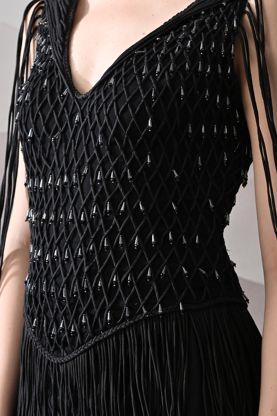 Black Gown With Artisanal Weave And Fringe Detailing