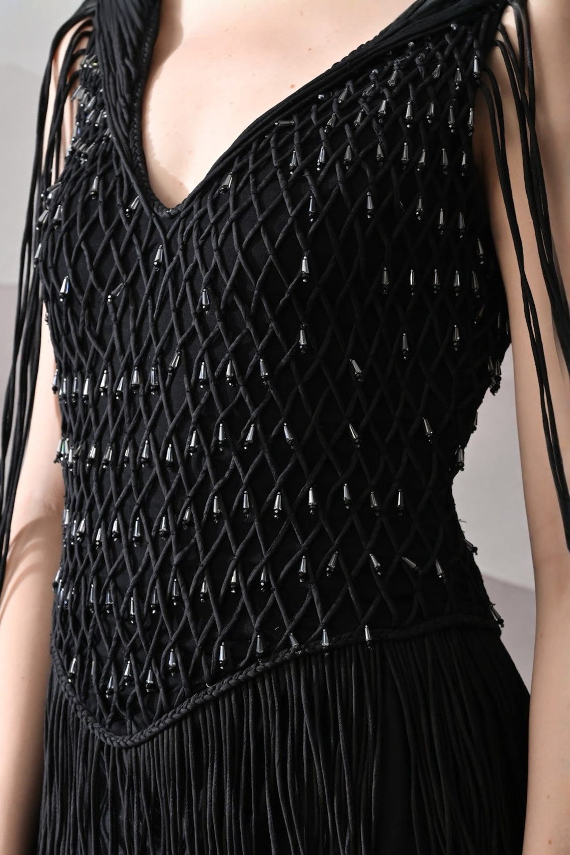 Black Gown With Artisanal Weave And Fringe Detailing