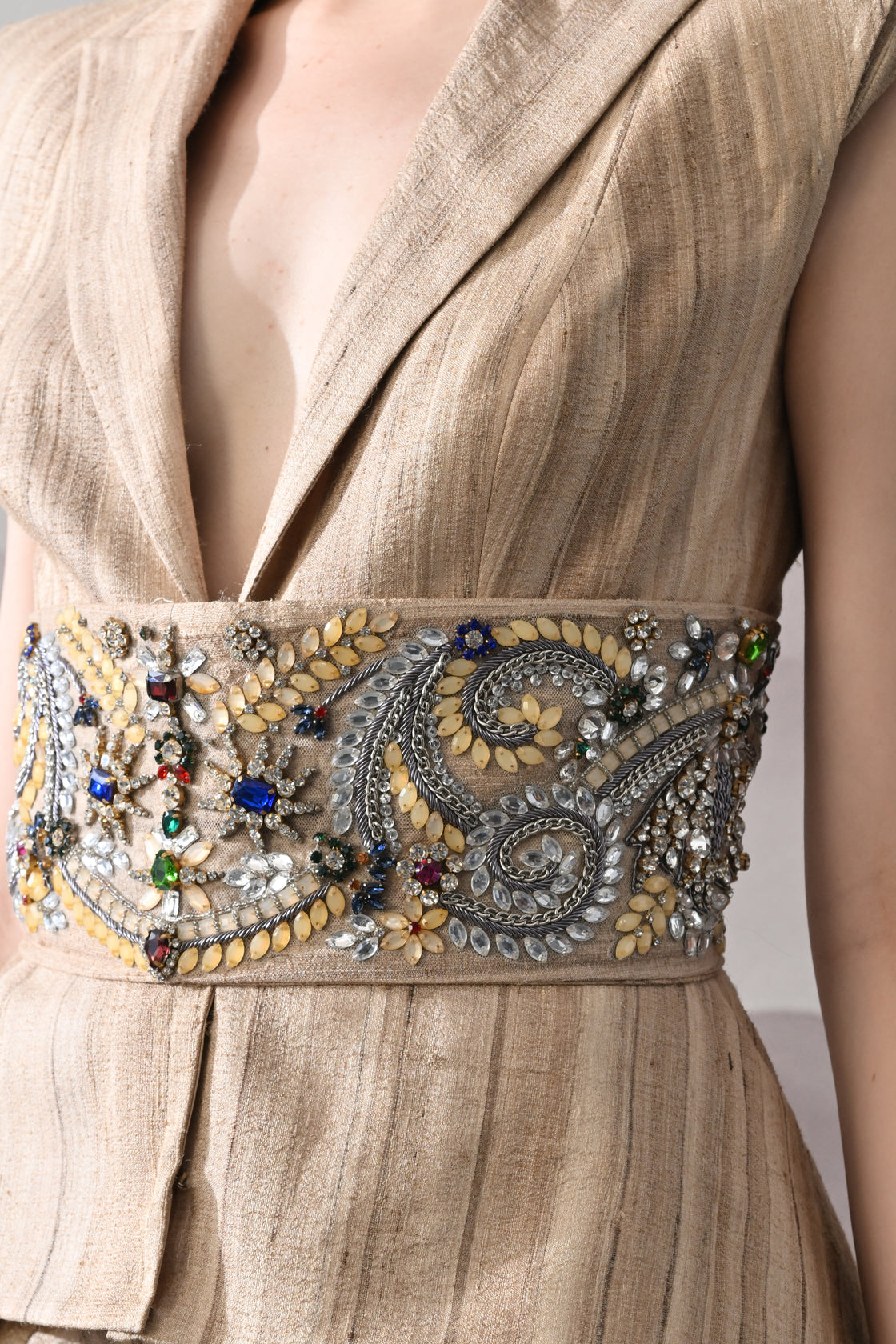 Beige Ensemble with Layered Construction and Embroidered Waist Accents