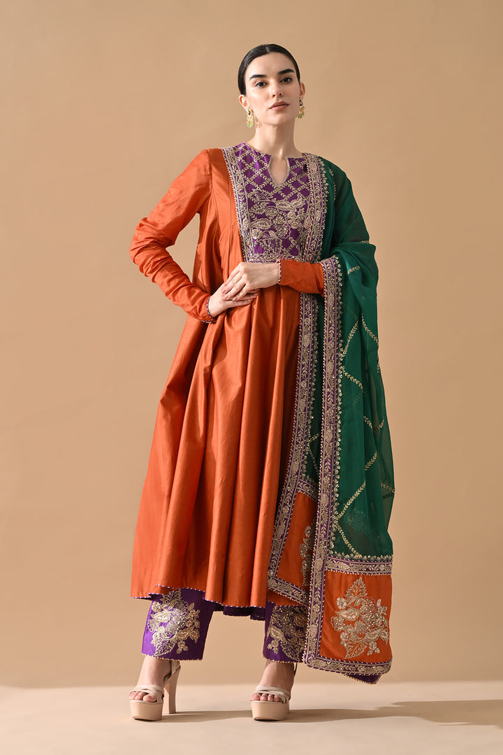Rust Orange Embroidered Kurta Set with Purple Accents and Green Dupatta